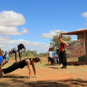 Cadi McCarthy working with Indigenous students as part of "Big Stretch".  Photo: James Welsby.