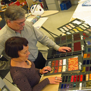 Francois Klaus and Noelene Hill in discussion over fabric swatches