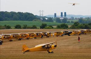 Piper Cubs gather at Oshkosh to celebrate the 75th anniversary of Piper Aircraft. (EAA)