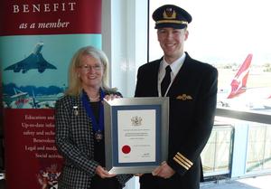 GAPAN Regional Chairman Sue Ball presents hands over a scholarship certificate at Adelaide Airport. (GAPAN)