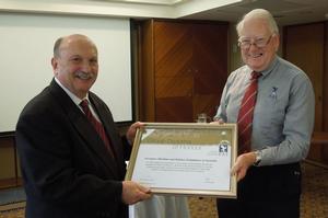 AMDFA CEO Ian Honnery (left) accepts an Honorary Group Diploma of Aeronautics from the FAI via ASAC's Bob Close. (ASAC)