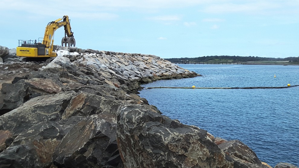 Building the breakwall is a painstaking operation requiring precision and some careful lifting.