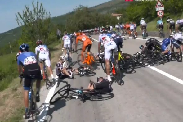 Numerous riders came down in the mass pileup caused by a police moto parked on the side of the road. Image: GranFondoGFNCS / Twitter.
