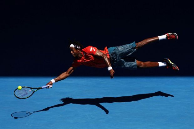 The Dive. Gaël Monfils of France dives for a forehand in his fourth round match against Andrey Kuznetsov of Russia, during the 2016 Australian Open at Melbourne Park, Australia, on 25 January 2016. 
Photo © Cameron Spencer, Australia, Getty Images, Sports second prize singles.