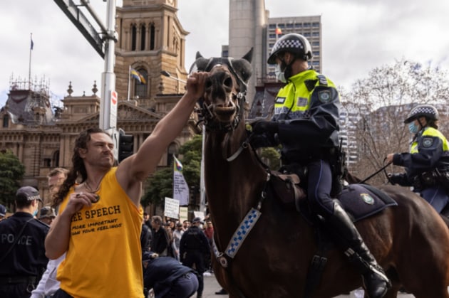 Finalist: Brook Mitchell, The Sydney Morning Herald, “Sydney Anti-Lockdown Protest. A protester makes contact with a police horse outside Town Hall during a chaotic anti-lockdown protest in Sydney on July 24, 2021.