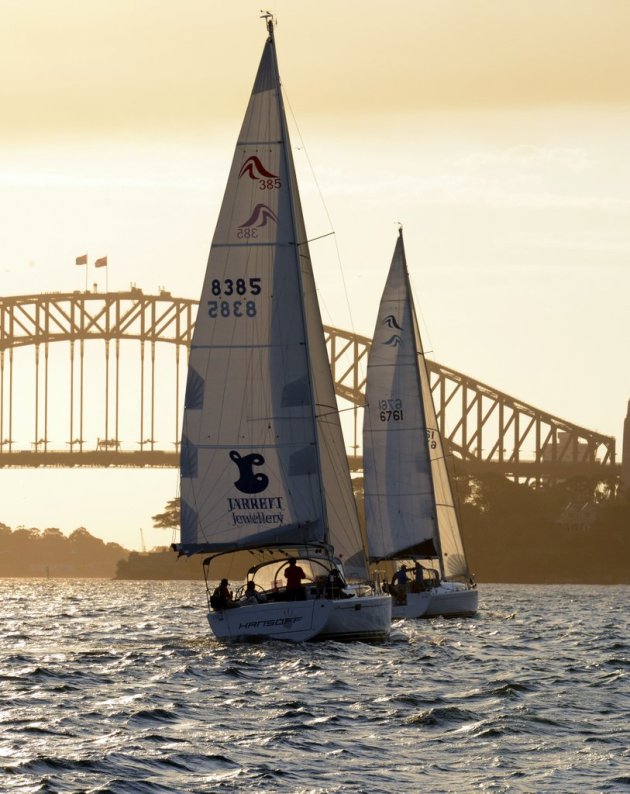 Sydney Harbour bridge backgrounds these two yachts in a winter race. Photo RSYS.