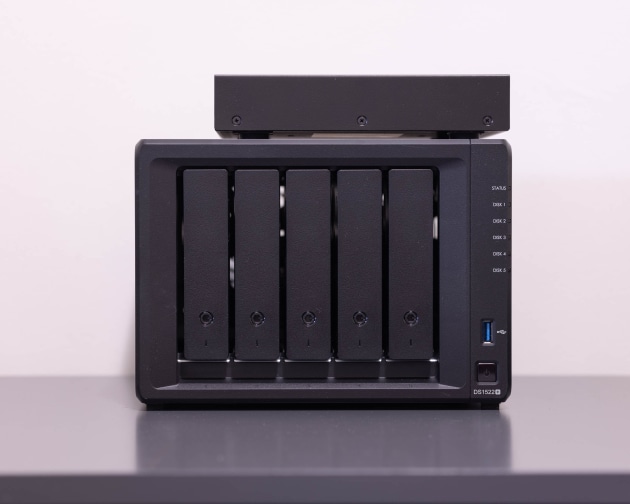 Synology DS1522+ NAS with QNAP 2104-2T 4 Port switch (on top)