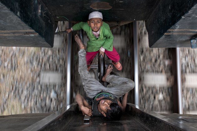 © Mauro di Bettio, Italy. Commended, Travel Portfolio TPOTY 2018. Taj and Akash travel every day from station to station with their mother, begging to make a living. Gazipur, Bangladesh.