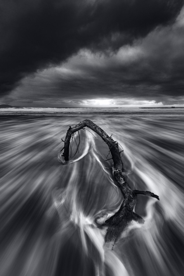 Marion Bay driftwood at dawn. Sony A7R II, Canon 16-35mm f4 lens, 1s @ f/16, ISO 100, tripod. Nisi three-stop, soft-edged GND and CPL filters. Monochromatic conversion, ‘radial blur’, colour and contrast adjustments in Photoshop.