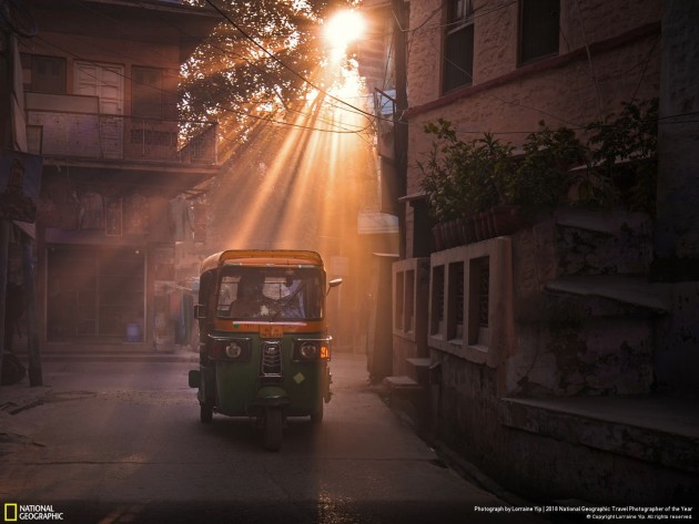 Shot in Jaipur during the "Golden Hours" of the day, it is easy to see why locals call this the "Pink City of India" - the soft rays cast from the late afternoon sun permeates every corner of the city, bringing out all shades of red and pink from within. As a taxi pierces through the thick fog of dust particles left behind by other passing cars, it gives off a mesmerising, yet mysterious feel, to this shot.