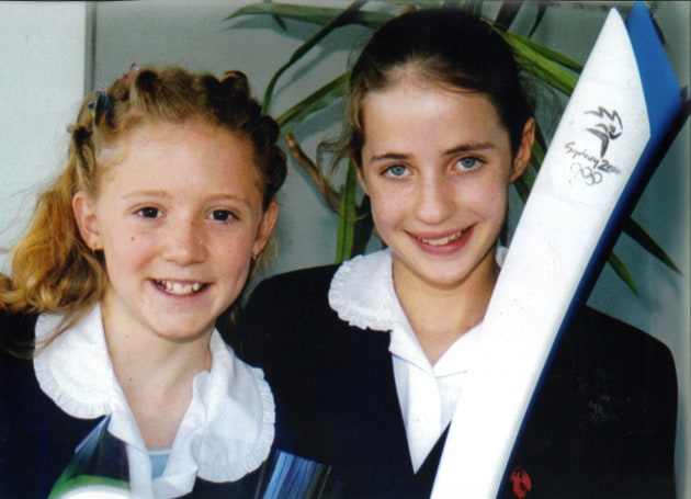 Nikki with the Olympic torch in 2000. Image supplied by The McDonald College.