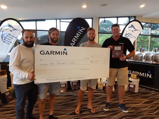 Nathan Bajada, with team Chasin' Tail - who received the award for most meritorious catch for tagging a black marlin from a dead boat - and Jason Browne from Garmin.