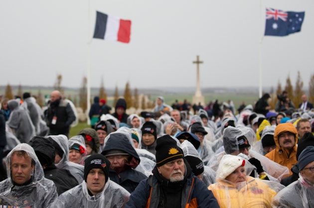 Members of the public brave the cold weather during the commemorative service for the centenary of the First World War Armistice, Australian National Memorial, Villers-Bretonneux, France. Defence