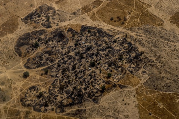 A burned Nigerian village seen from a United Nations helicopter flying between Maiduguri and Monguno. Villages have been razed and burned by both Boko Haram and the Nigerian Military throughout the region.
© Ashley Gilbertson, Australia, Shortlist, Professional, Landscape (Professional competition), 2018 Sony World Photography Awards