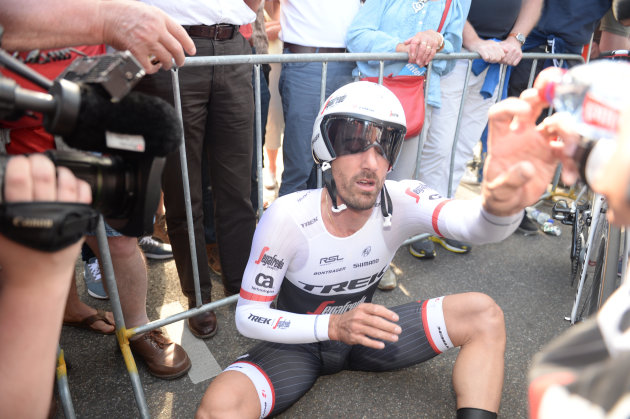 Cancellara reached the finish line and rested on the floor after an all-out time trial where only seconds split the field on Stage 1 of the Giro. Photo by Sirotti