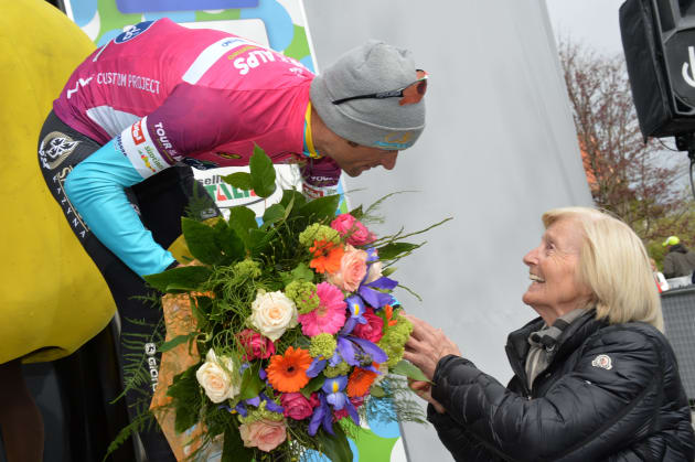 Ever a crowd favourite, Scarponi speaks with a fan while wearing the leader's jersey at the Tour of the Alps. Image: Sirotti