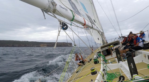 Heading out through the Heads on board Sanya Serenity Coast, one of the Clipper race yachts. That's Phil Ross, Criusing Helmsman editor, on the port rail taking photos.