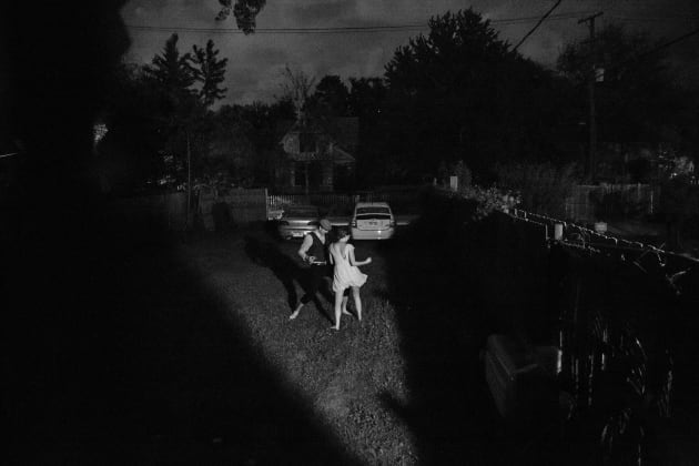 Last Dance: A couple dances in the backyard of a home in the West Village neighborhood of Detroit. Amy Sacka, Detroit, Michigan