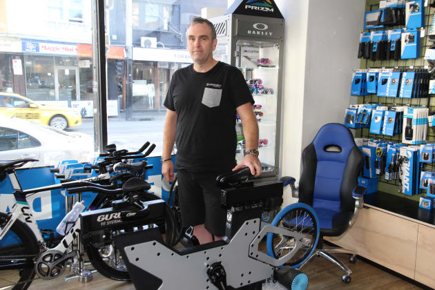 Craig Jansen with his Guru fit system. He bought special blue chair in the background to help him recover from a serious spinal injury as a result of an accident.