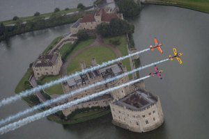 Matt Hall leads Nicholas Ivanoff and Kirby Chambliss in a promo formation over Leeds Castle in Kent. (Red Bull Content Pool)
