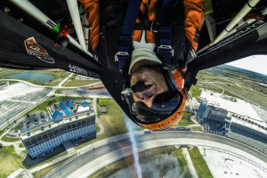 Frenchman Nicholas Ivanov rolls high over the Texas Motor Speedway, where he scored his first win of the 2014 Red Bull Air Race season. (Red Bull Content Pool)