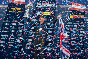 Nigel Lamb holds the championship trophy high for the first time since joining the Red Bull Air Race in 2005. (Red Bull Content Pool)