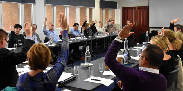 Members vote at the NPCIA meeting to approve the new governance structure.