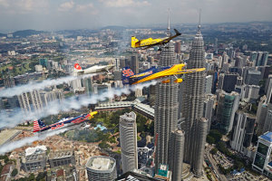 Matt Hall flies in formation with Nigel Lamb of Great Britain, Yoshihide Muroya of Japan and Kirby Chambliss of the United States in front of the Petronas Towers in Kuala Lumpur, Malaysia.(Balasz Gardi/Red Bull Content Pool)