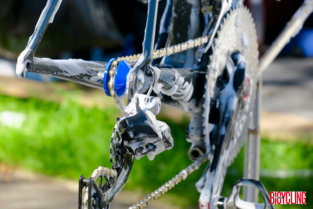 Cleaning and checking each of the team bikes is a critical part of each afternoon's work for mechanics. Image: Nat Bromhead