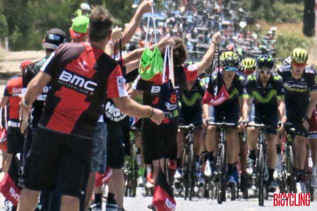 Riders approach a feed zone during Stage 4 of the tour. Image: Nat Bromhead.