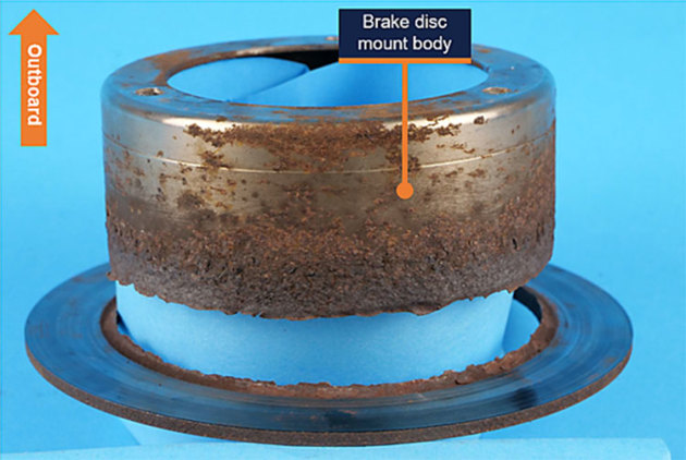 The fractured brake disc off Sling VH-PPY. (ATSB)