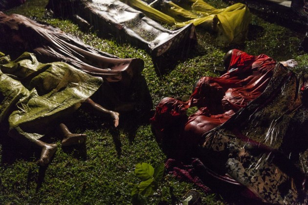 Rohingya Crisis. World Press Photo of the Year Nominee. © Patrick Brown. 
The bodies of Rohingya refugees are laid out after the boat in which they were attempting to flee Myanmar capsized about eight kilometers off Inani Beach, near Cox's Bazar, Bangladesh. Around 100 people were on the boat before it capsized. There were 17 survivors.
The Rohingya are a predominantly Muslim minority group in Rakhine State, western Myanmar. They number around one million people, but laws passed in the 1980s effectively deprived them of Myanmar citizenship. Violence erupted in Myanmar on 25 August after a faction of Rohingya militants attacked police posts, killing 12 members of the Myanmar security forces. Myanmar authorities, in places supported by groups of Buddhists, launched a crackdown, attacking Rohingya villages and burning houses. 
Commissioned by Panos Pictures, for UNICEF.