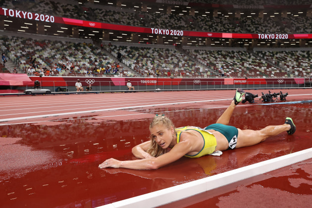 TOKYO, JAPAN - AUGUST 04: Genevieve Gregson of Team Australia lays injured during the Women's 3000m Steeplechase Final on day twelve of the Tokyo 2020 Olympic Games at Olympic Stadium on August 04, 2021 in Tokyo, Japan. (Photo by David Ramos/Getty Images)