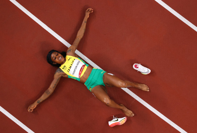 TOKYO, JAPAN - AUGUST 03: Elaine Thompson-Herah of Team Jamaica celebrates after winning the gold medal in the Women's 200m Final on day eleven of the Tokyo 2020 Olympic Games at Olympic Stadium on August 03, 2021 in Tokyo, Japan. (Photo by Richard Heathcote/Getty Images)