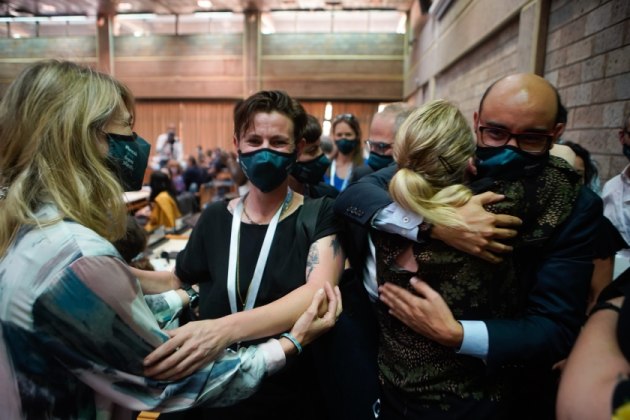 Delegates at the UN Environment Assembly embrace as a resolution is signed to begin negotiations for a global treaty to end plastic pollution is a major milestone for addressing the issue. (Image source: UNEP)