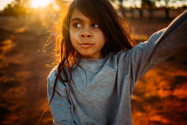 © Klarissa Dempsey. Wonder, 2019. "This portrait is of my daughter Tayla. High-spirited, mischievous, intelligent, curious: these are some of the words that come to mind while thinking of her. Tayla always asks questions and needs to know the ‘why’; I love that about her. I love that she is one of the kindest souls you will ever meet, with the most caring heart. This moment was captured on country homelands, where Tayla spends her time playing endlessly with her brothers and sister and cousins, riding bikes, walking to the creeks, playing with the dogs and being carefree."