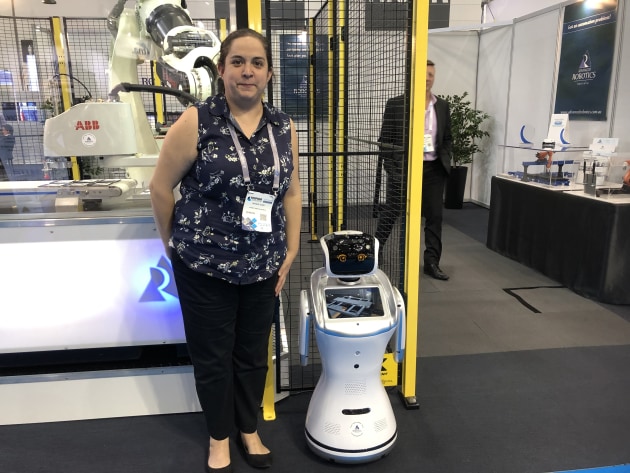 Natalia Vejar and Sanbot on the Advanced Robotics stand.