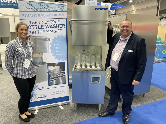 Rhima marketing manager Sarah Vandertop (left) and CEO Mark Hollingsworth with the bottle washer at AUSPACK earlier this year.