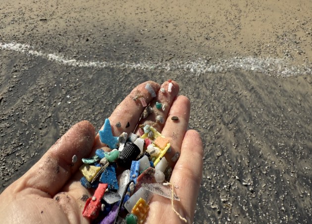 It is the effect of plastic, not its production or consumption that is the main issue. [Microplastics on Sunshine Beach, Qld, April 2025. (Image: Lindy Hughson)]