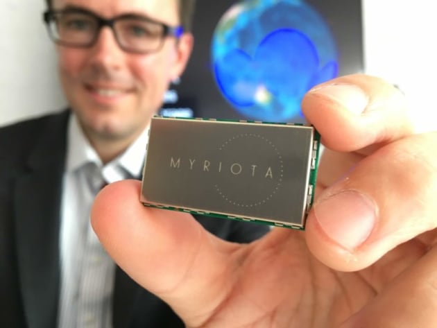 Myriota CEO Dr Alex Grant with one of Myriota’s low-cost, long battery life satellite transmitters. Credit: Myriota