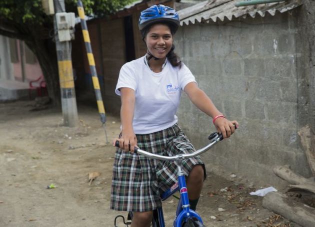 Dayana, a 16 year old Year 8 student, with her new bike.