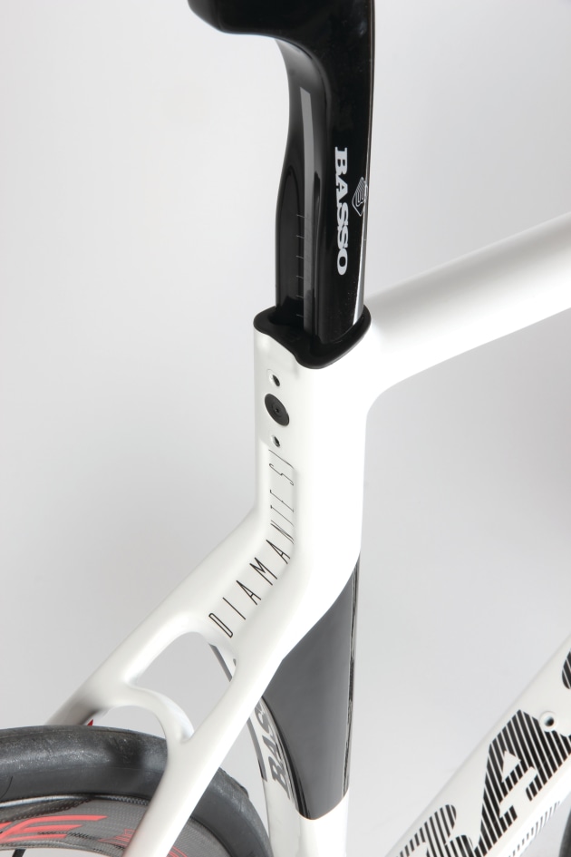 Proprietary hidden aero post clamp with vibration mitigation built in clamp.
