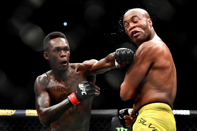 © Quinn Rooney. The Art of Sports Photography. Israel Adesanya of Nigeria punches Anderson Silva of Brazil during their Middleweight bout during UFC234 at Rod Laver Arena on February 10, 2019 in Melbourne, Australia.