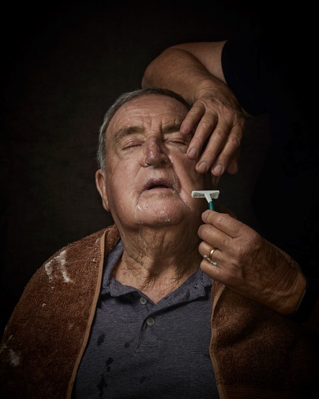 Portrait of an elderly man and daughter. © Sam Scoufos.