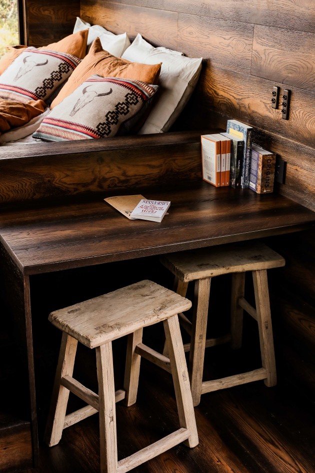Inside the off-the-grid cabin, The Reserve by Wild Turkey x Unyoked. The solar-powered, no-wifi cabin was built with only used sustainable materials. Matthew McConaughey, creative director for Wild Turkey curated the reading materials.