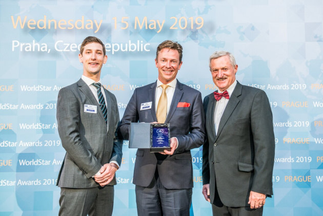 Caps and Closures' Michael van Dord (left) and Brendon Holmes (right) receive their award from fellow Australian, WPO president Pierre Pienaar.