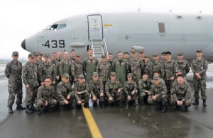 US Navy Sailors attached to Patrol Squadron (VP) 16 and Republic of Korea navy sailors line up for a photo in front of a US Navy P-8A Poseidon aircraft March 30 in Busan, Republic of Korea. (Photo by Joshua Bryce Bruns).