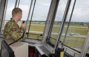 Joint Battlefield Airspace Controller (JBAC) Flight Lieutenant Sam Gastner, keeps an eye on the departure of an F/A-18 Hornet at RMAF Butterworth. [Photo:Defence]