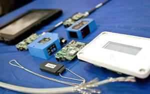 Components and hardware on static display at the demonstration for the Naval Automated Personnel Tracker system.