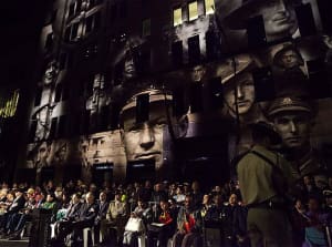 The faces of Australian veterans of war are projected on the facade of Martin Place during the 2016 Anzac Day dawn service in Sydney. Credit: Defence